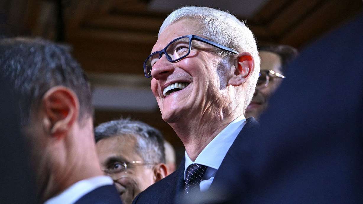 Apple CEO Tim Cook attends the World Economic Forum's annual meeting in Davos, Switzerland, on Jan. 21. Apple reported earnings that blew past Wall Street's expectations on Thursday, largely driven by the iPhone 17.