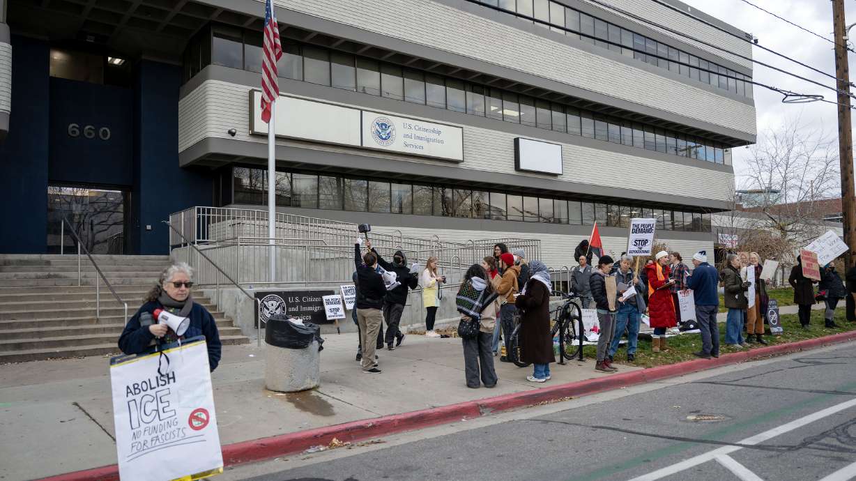 Protestors at the Salt Lake City immigration officeon Dec. 8, 2025. An attorney is crying foul after immigration officials canceled a client's appointment because her U.S. citizen husband is from Venezuela.