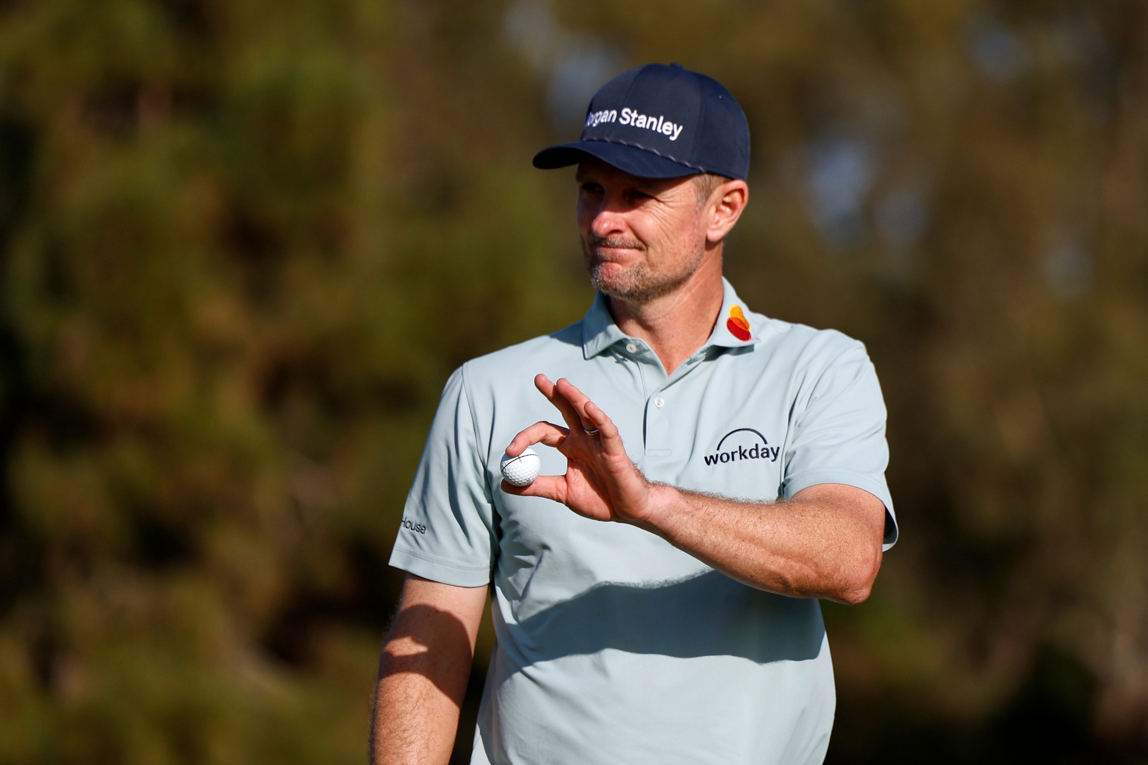 Justin Rose, of England, waves after finishing on the eighth hole on the North Course at Torrey Pines during the first round of the Farmers Insurance Open golf tournament Thursday, Jan. 29, 2026, in San Diego. 