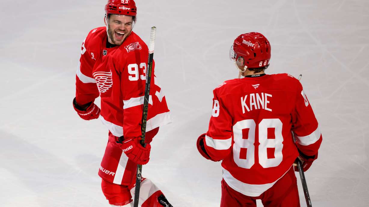 Detroit Red Wings right wing Alex DeBrincat (93) Detroit Red Wings right wing Patrick Kane (88) after scoring the game-winning goal against the Ottawa Senators in overtime of an NHL hockey game, Sunday, Jan. 18, 2026, in Detroit.