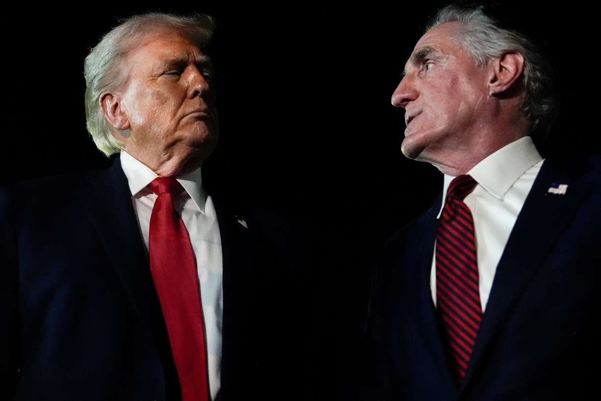 President Donald Trump and Interior Secretary Doug Burgum speak with reporters Jan. 19 in West Palm Beach, Fla. Interior Secretary Doug Burgum has asked Colorado River governors to meet together in Washington, D.C., on Friday.