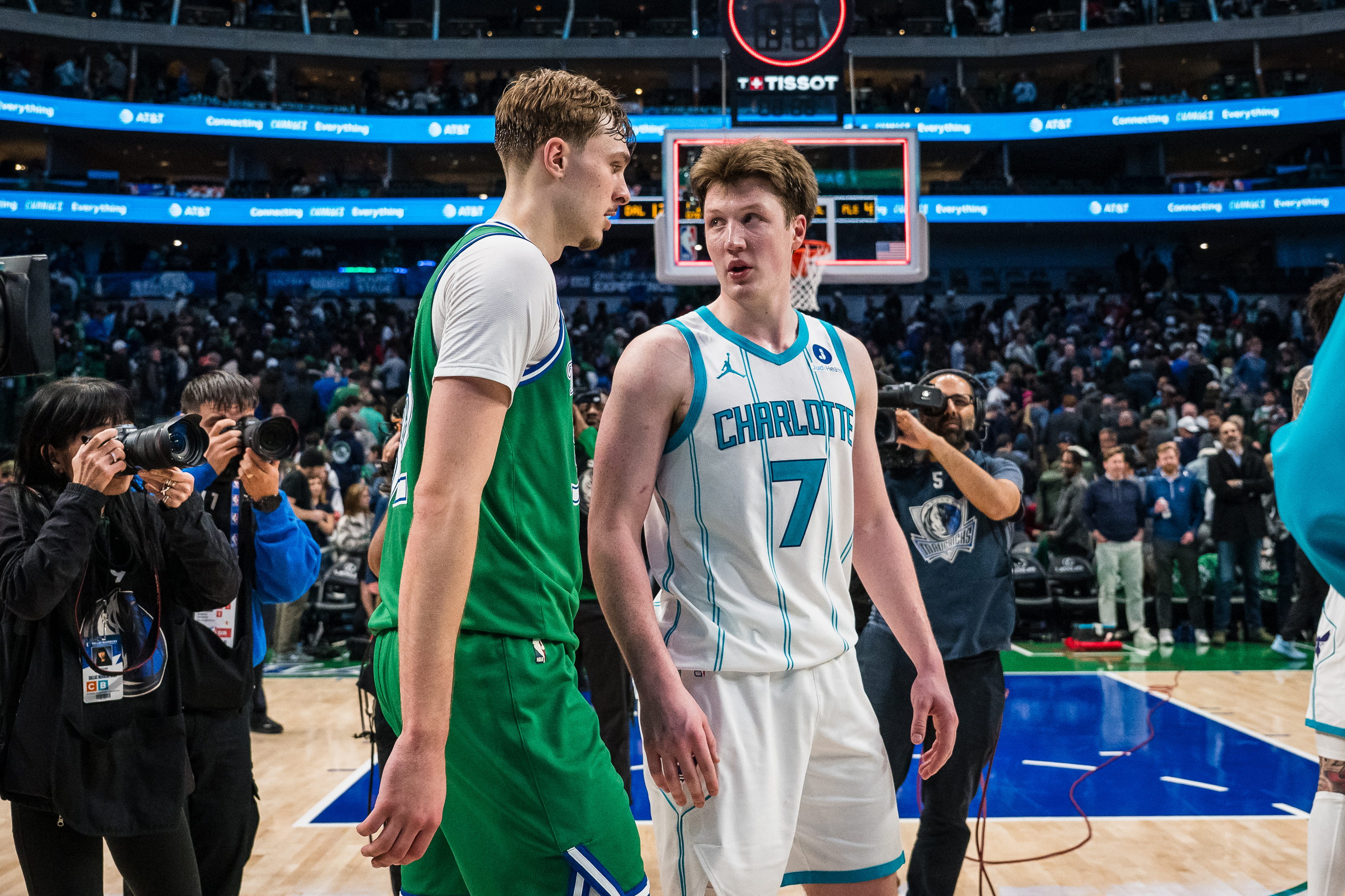 Dallas Mavericks forward Cooper Flagg, center left, and Charlotte Hornets guard Kon Knueppel (7) talk after an NBA basketball game, Thursday, Jan. 29, 2026, in Dallas. 
