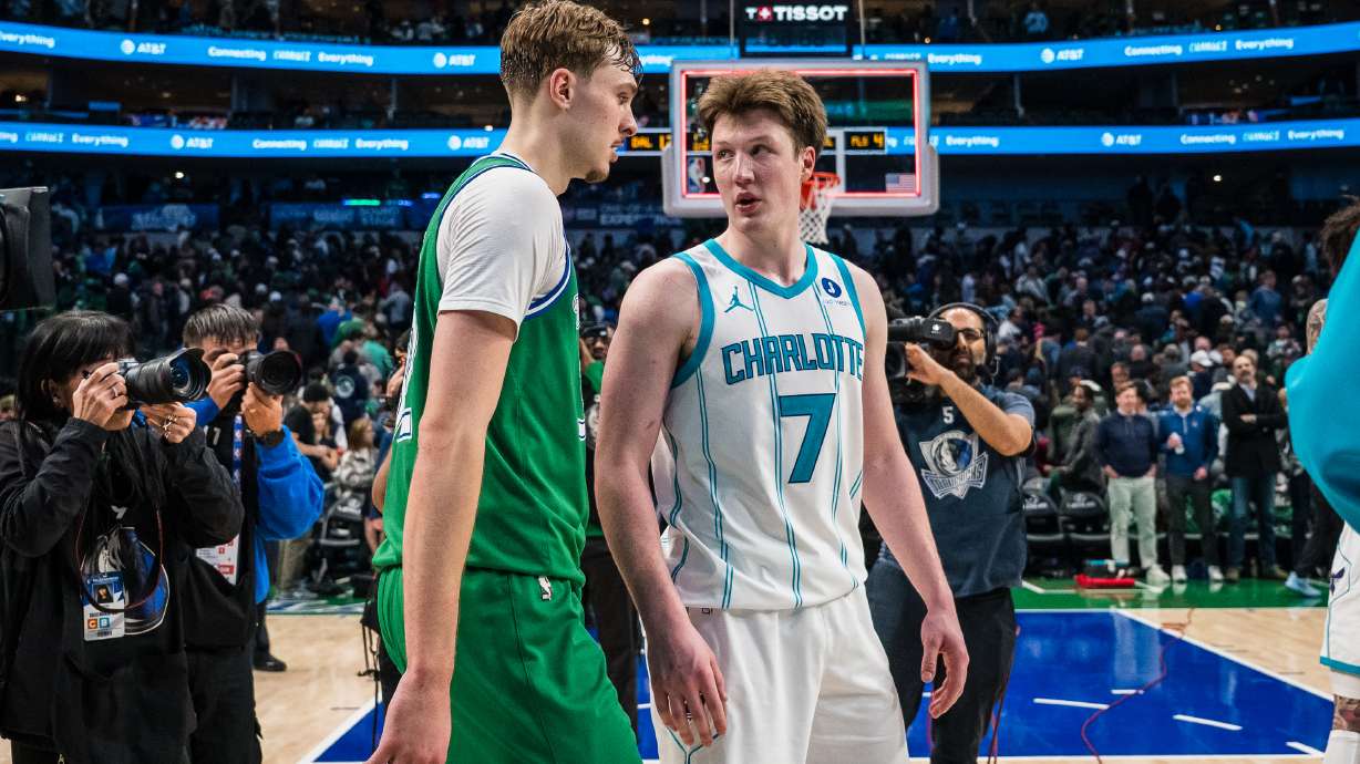 Dallas Mavericks forward Cooper Flagg, center left, and Charlotte Hornets guard Kon Knueppel (7) talk after an NBA basketball game, Thursday, Jan. 29, 2026, in Dallas.