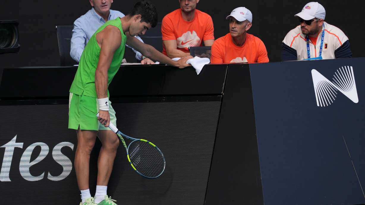 Carlos Alcaraz of Spain talks to his team during his semifinal match against o Alexander Zverev of Germany at the Australian Open tennis championship in Melbourne, Australia, Friday, Jan. 30, 2026.