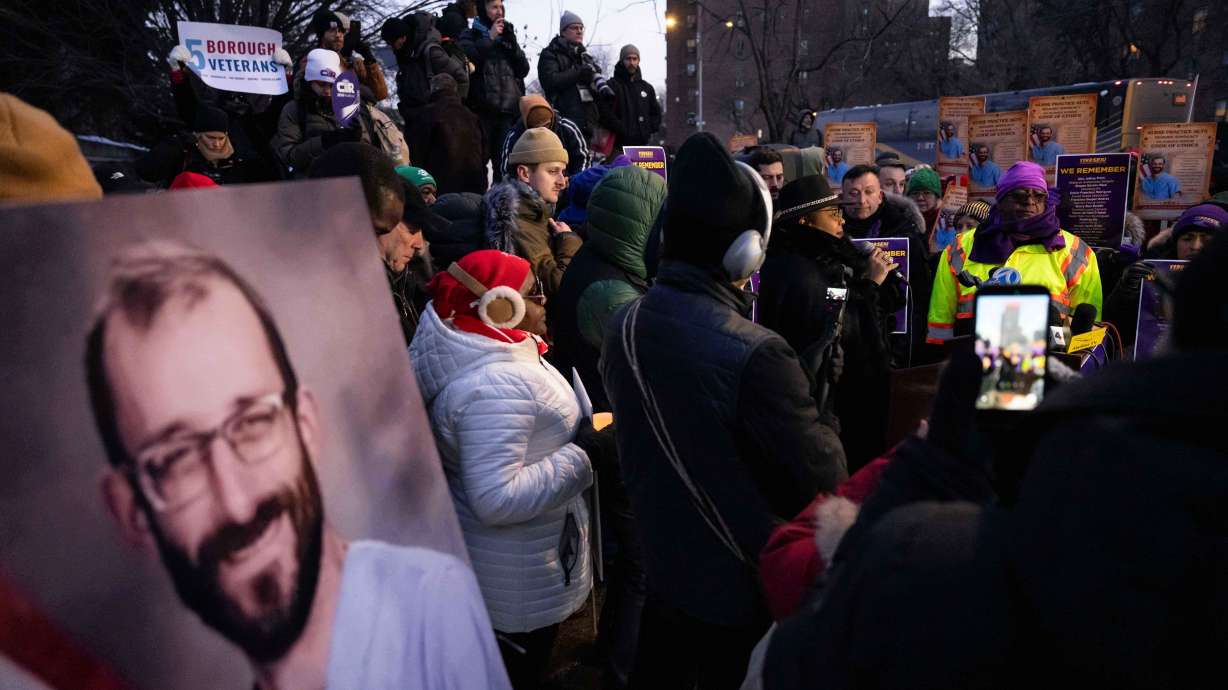 A photo of Alex Pretti is displayed during a vigil for Alex Pretti by nurses and their supporters outside VA NY Harbor Healthcare System, Thursday, in New York. The DOJ has opened a federal civil rights investigation into Pretti's death.