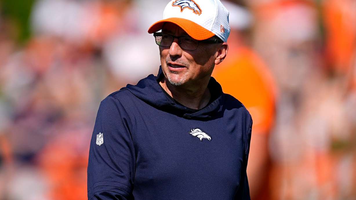 FILE - Denver Broncos senior offensive assistant Pete Carmichael looks on at an NFL football training camp Friday, Aug. 2, 2024, at the team's headquarters in Centennial, Colo.