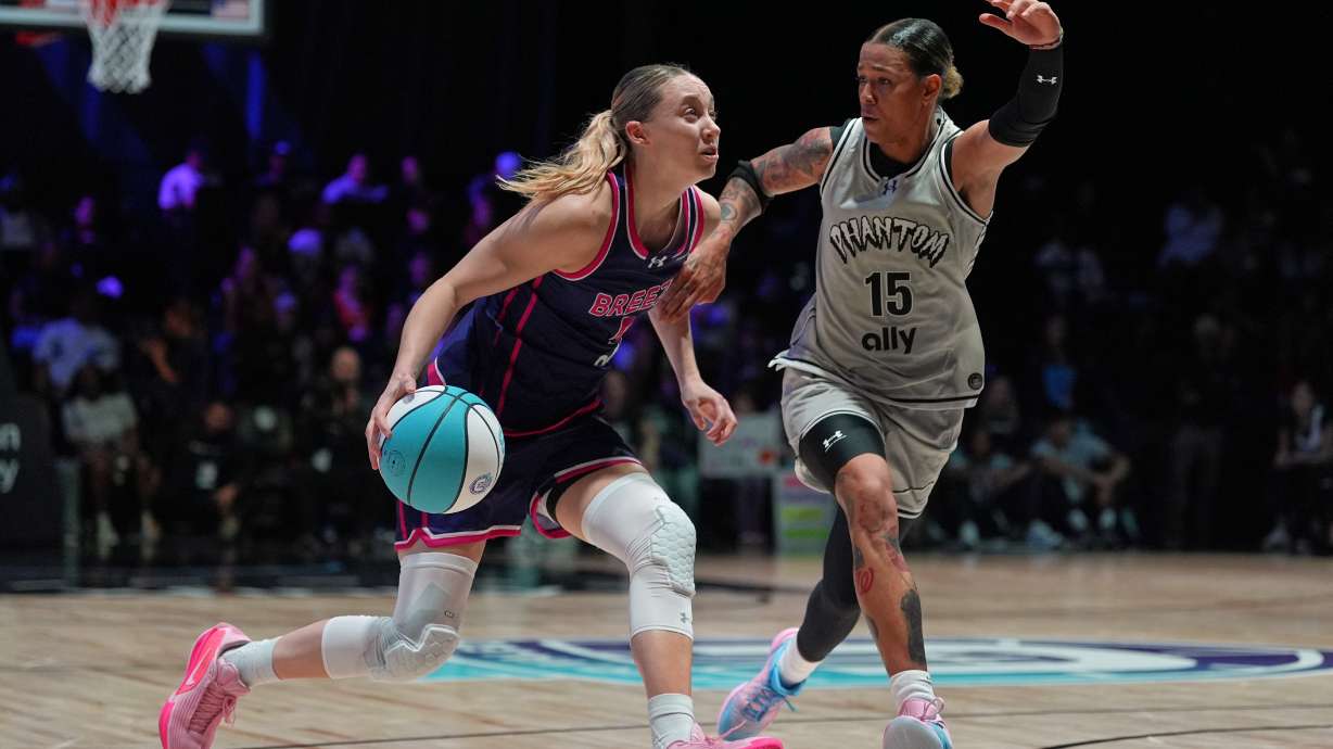 Breeze BC guard Paige Bueckers (5) drives forward defended by Phantom BC wing Natasha Cloud (15) in their Unrivaled 3-on-3 basketball game, Monday, Jan. 5, 2026, in Medley, Fla.