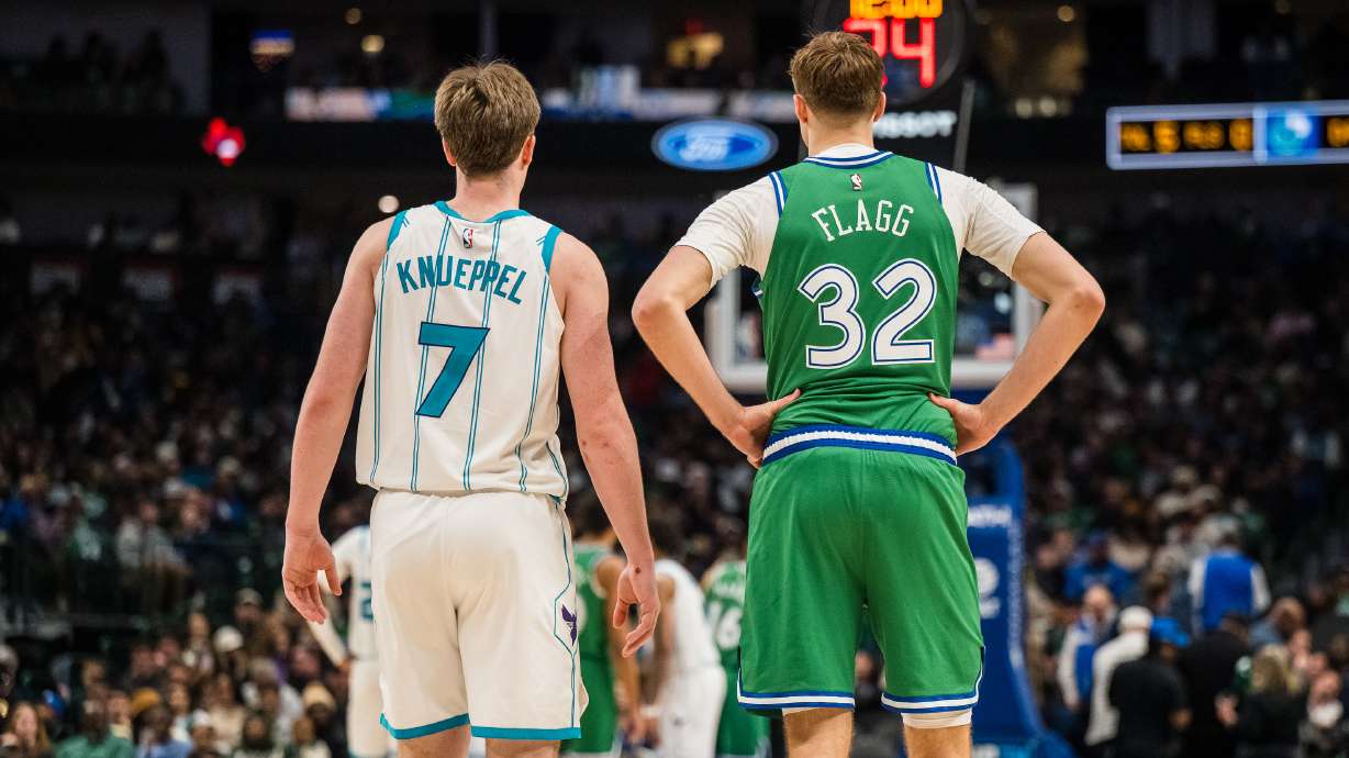 Charlotte Hornets guard Kon Knueppel (7) and Dallas Mavericks forward Cooper Flagg (32) wait for play to start during an NBA basketball game, Thursday, Jan. 29, 2026, in Dallas.