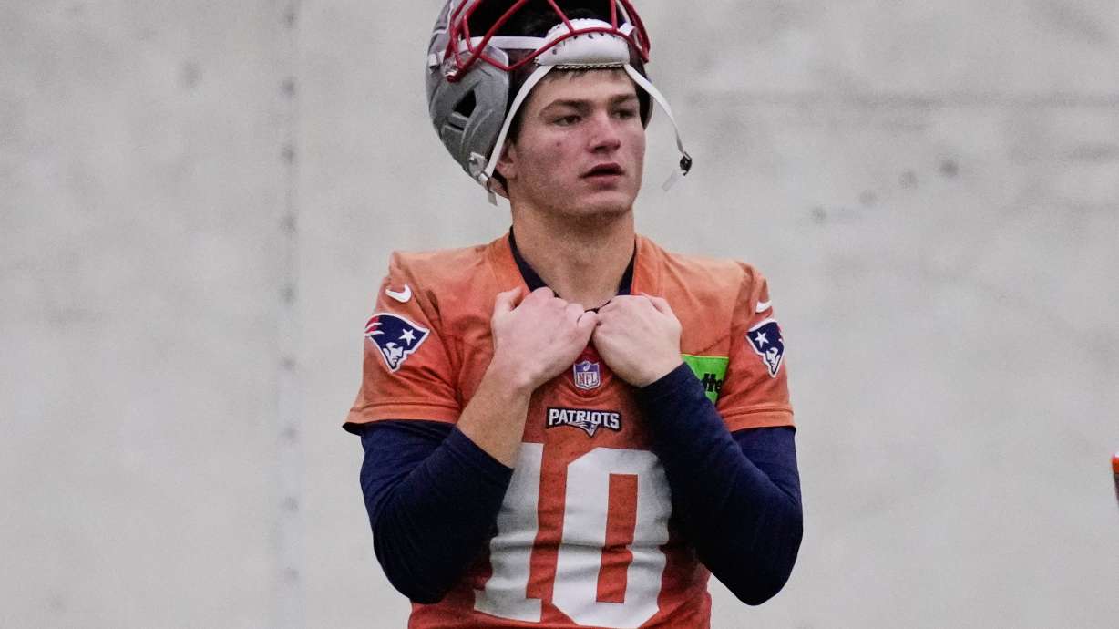 New England Patriots quarterback Drake Maye watches teammates during an NFL football availability, Thursday, Jan. 29, 2026, in Foxborough, Mass.