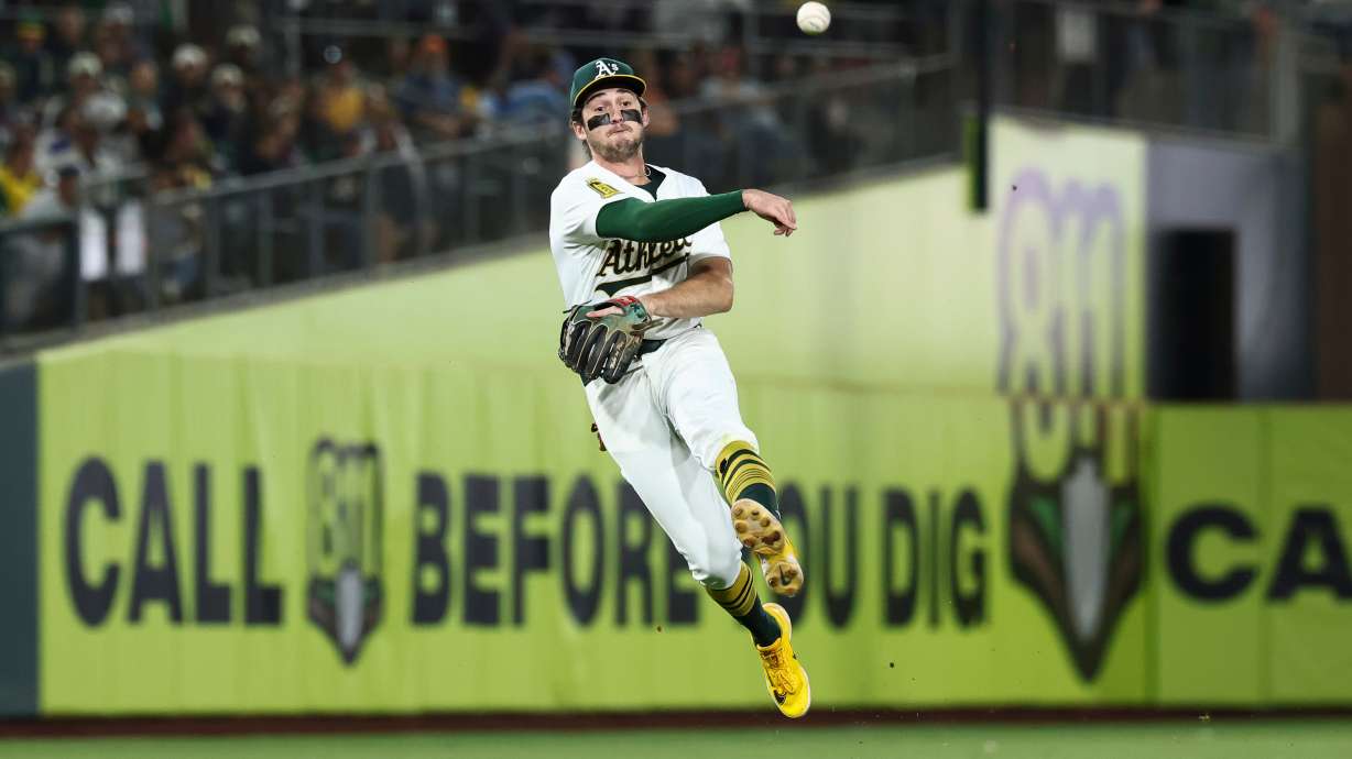 FILE - Athletics shortstop Jacob Wilson throws to first base during the seventh inning of a baseball game against the Kansas City Royals in West Sacramento, Calif., Sept. 27, 2025.