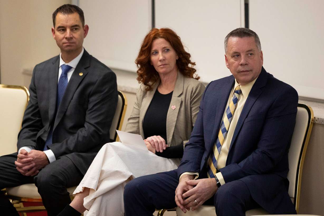 Tom Ross, director of the Utah Commission on Criminal and Juvenile Justice, right, looks on during the Utah Crime Summit keynote address at the Thomas S. Monson Center in Salt Lake City on Tuesday.