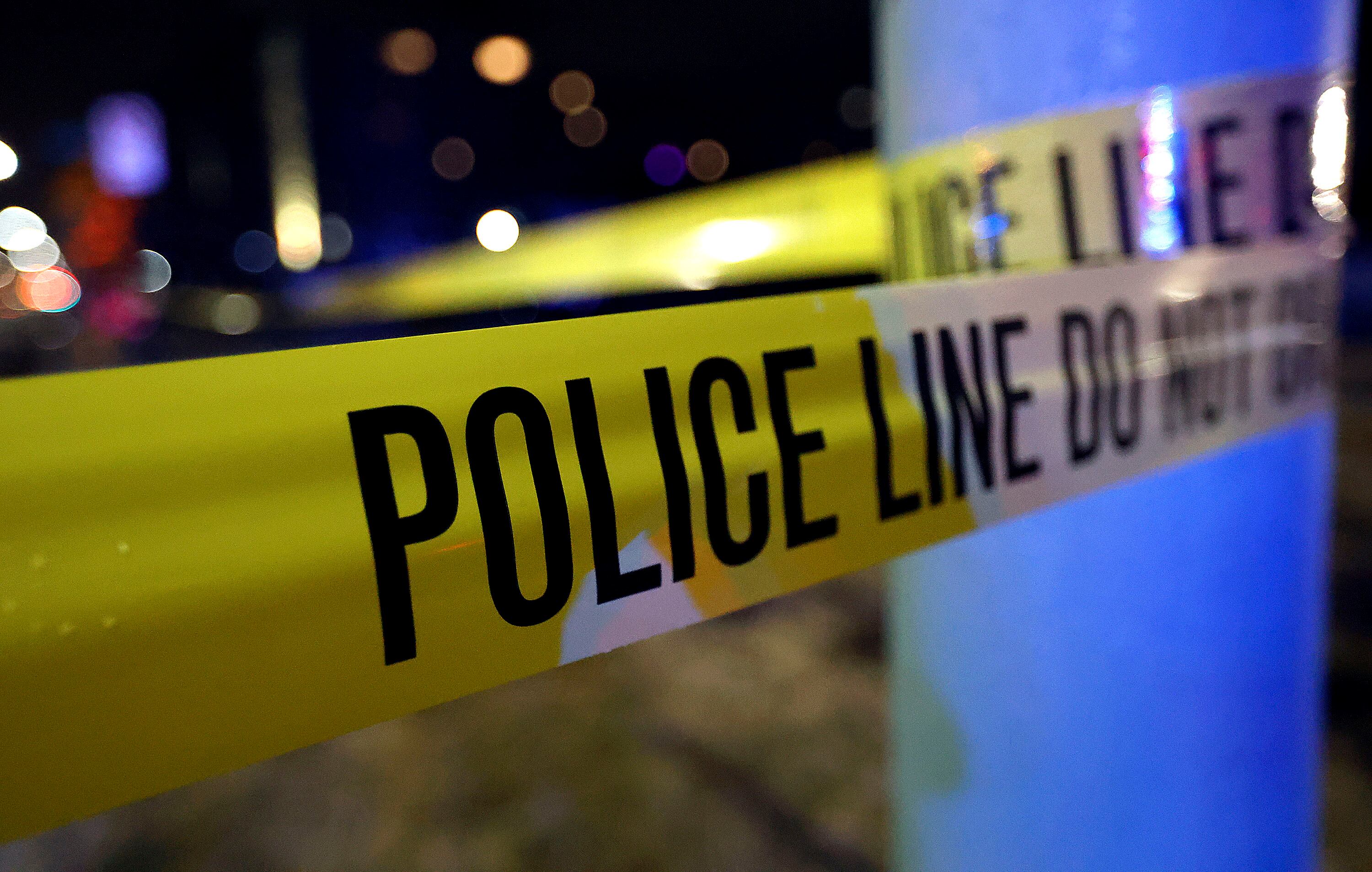 Police tape hangs at the scene of a fatal hit-and-run where a pedestrian was killed on the corner of Coatsville Avenue and Main Street in Salt Lake City on March 15, 2021.