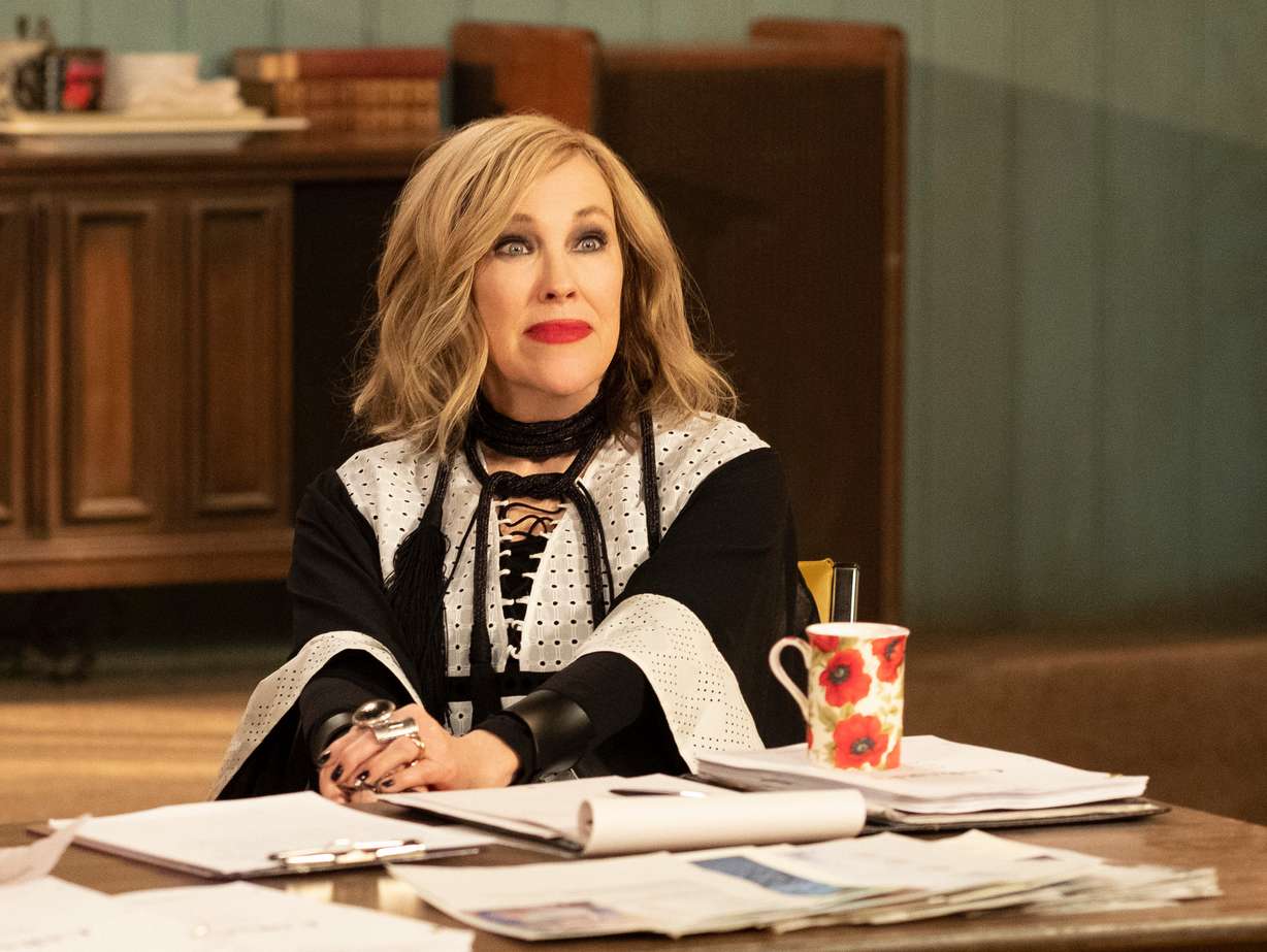 This image released by Pop TV shows Catherine O'Hara in a scene from "Schitt's Creek." O'Hara, who died on Friday at the age of 71, won a Golden Globe and a SAG Award for her role in the show.
