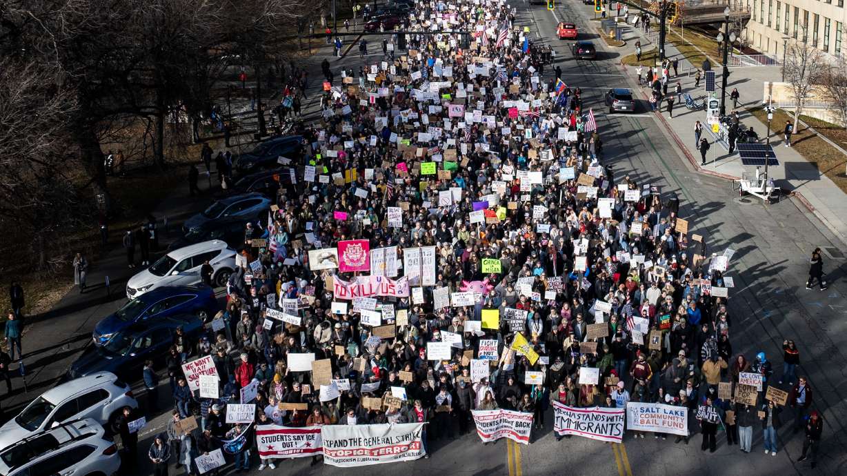 Thousands of protesters march in Salt Lake City on Friday. The demonstration, one of many around Utah, started at Washington Square and then participants marched south to the U.S. Citizenship and Immigration Services office.