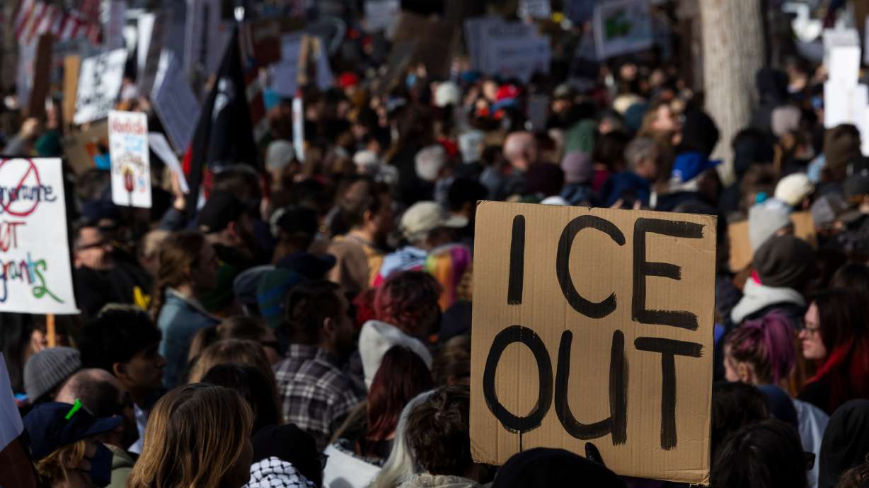 Thousands of people attend an anti-ICE protest at Washington Square Park in Salt Lake City on Jan. 30. Two men were charged Wednesday with assaulting police officers during the protest.