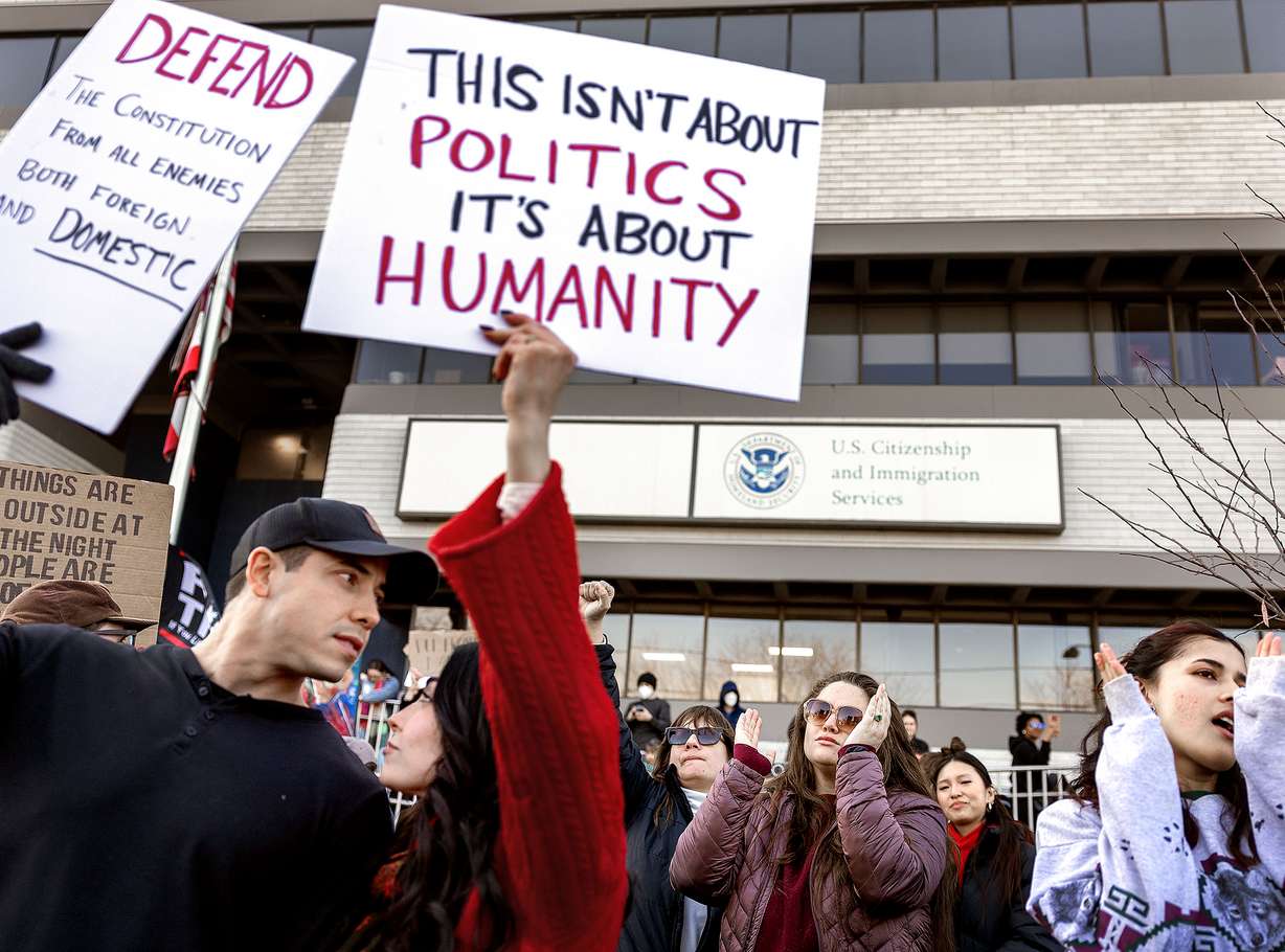 Anti-ICE protesters chant outside the U.S. Citizenship and Immigration Services building in Salt Lake City on Friday.