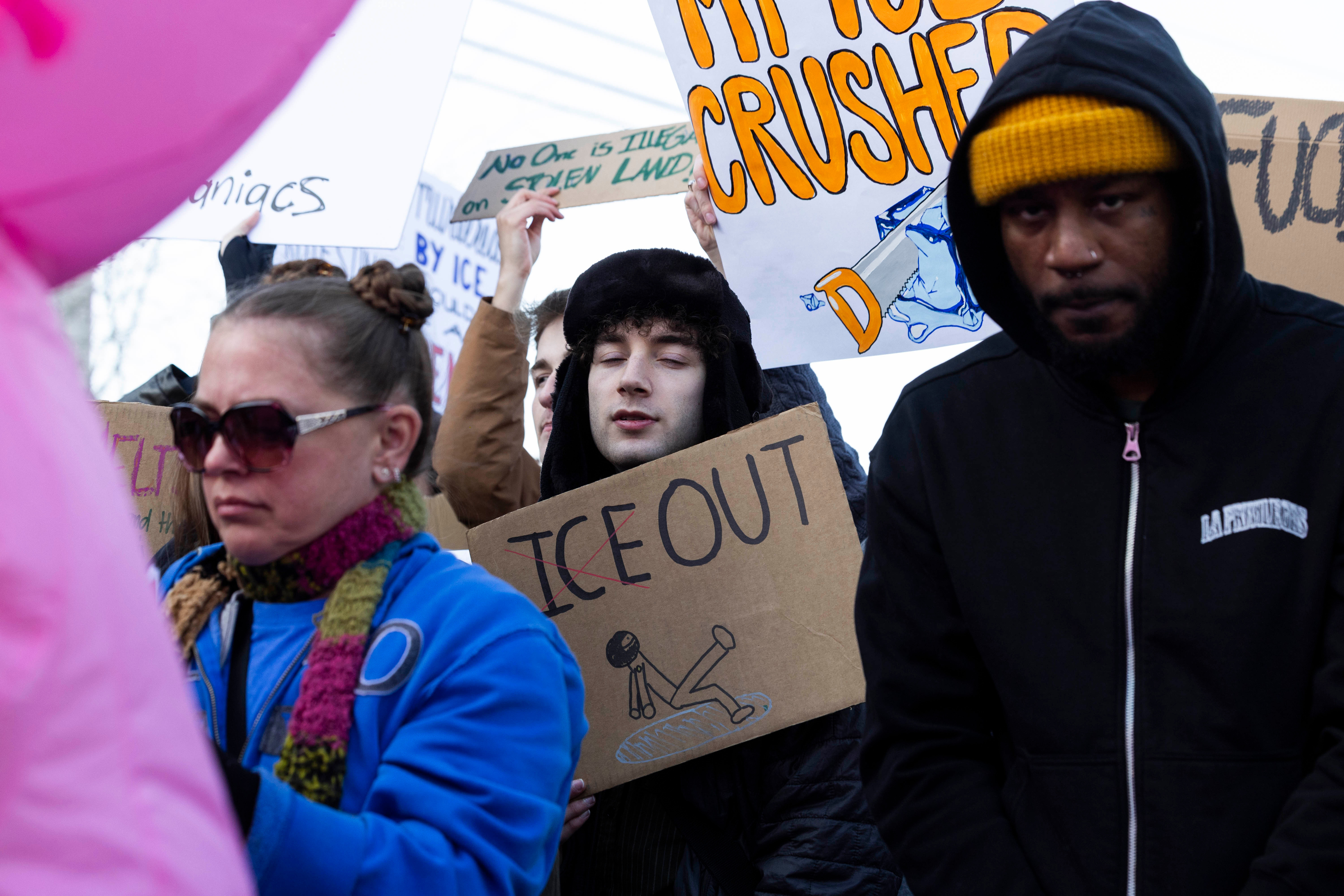 Anti-ICE protesters gather outside the U.S. Citizenship and Immigration Services building in Salt Lake City on Friday.