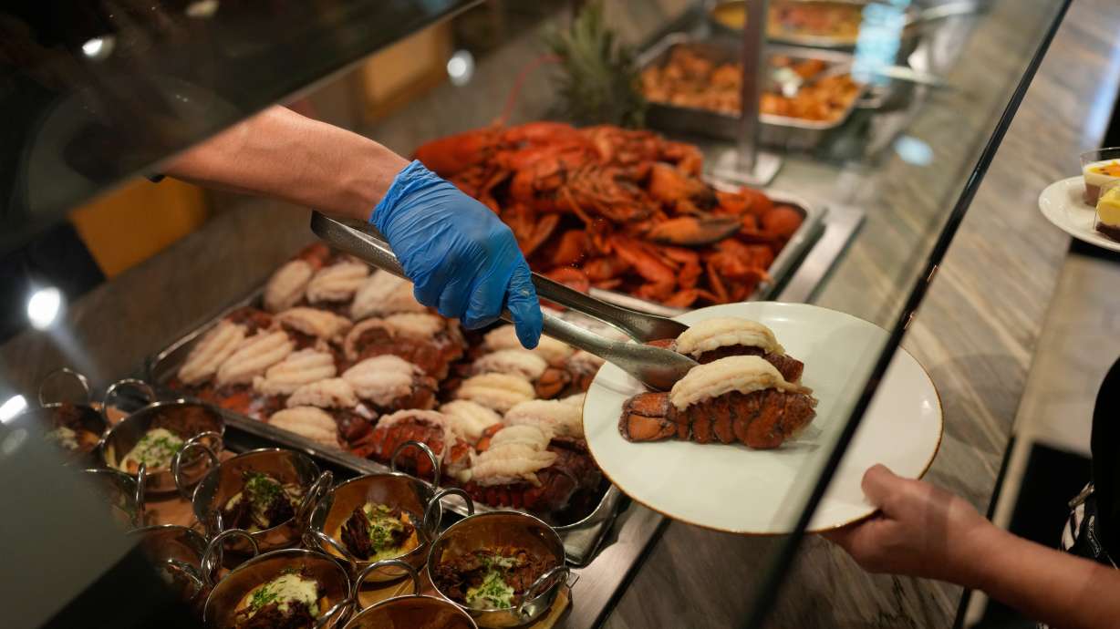 A person serves lobster tails at the A.Y.C.E Buffet in the Palms resort-casino Wednesday in Las Vegas.
