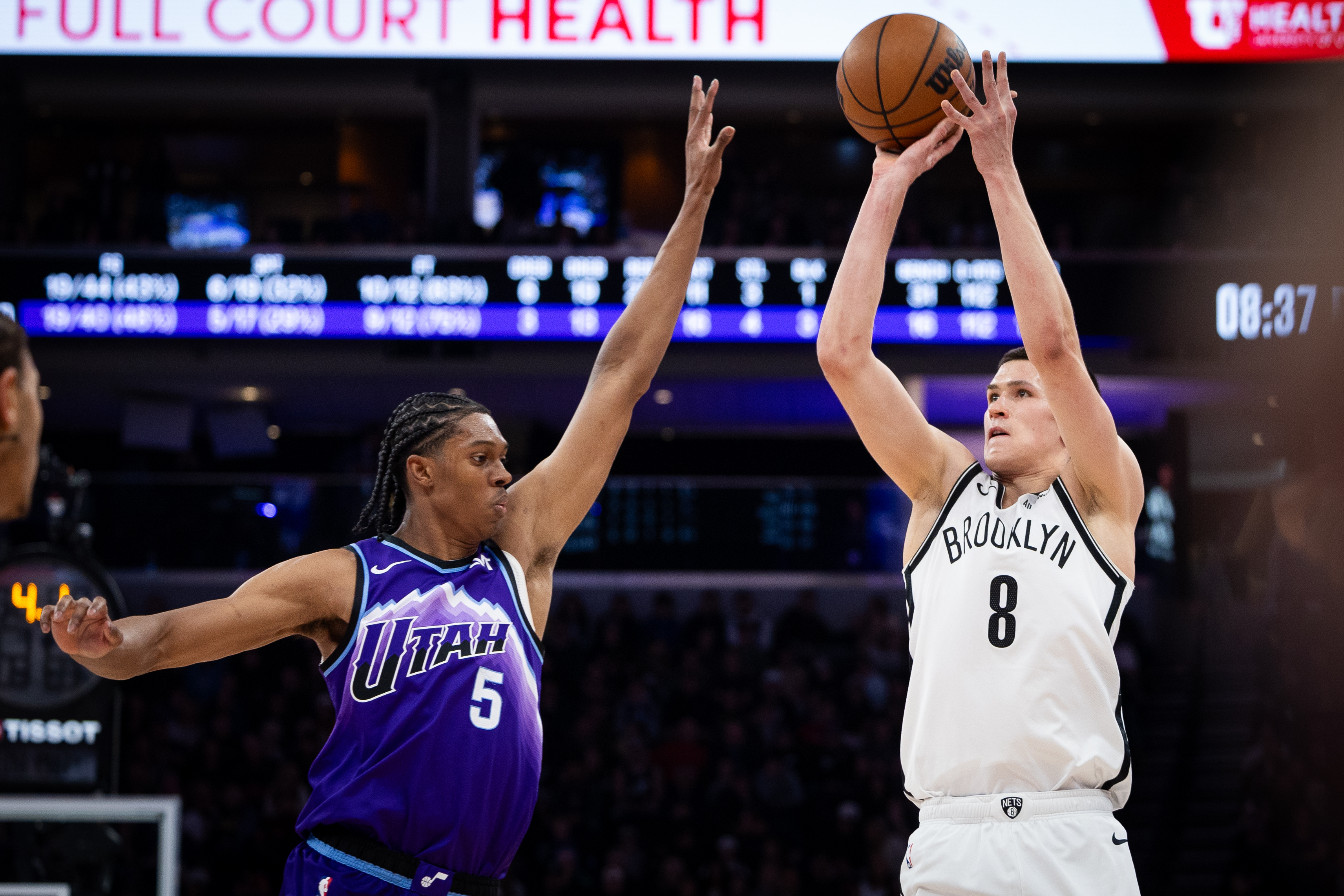 Brooklyn Nets guard Egor Dëmin (8) looks to shoot over Utah Jazz forward Cody Williams (5) during the first half of an NBA basketball game, Friday, Jan. 30, 2026, in Salt Lake City. 