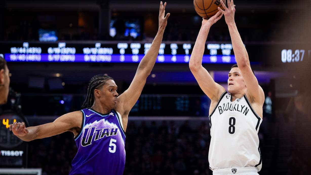 Brooklyn Nets guard Egor Dëmin (8) looks to shoot over Utah Jazz forward Cody Williams (5) during the first half of an NBA basketball game, Friday, Jan. 30, 2026, in Salt Lake City.