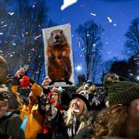 Punxsutawney Phil prepares to issue his Groundhog Day weather verdict from Gobbler's Knob