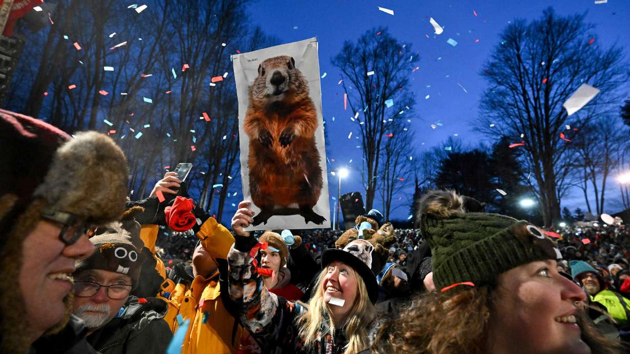 The crowd watches the festivities while waiting for Punxsutawney Phil, the weather prognosticating groundhog, to come out and make his prediction during the 139th celebration of Groundhog Day on Gobbler's Knob in Punxsutawney, Pa., Feb. 2. The town is eagerly awaiting his 2026 prediction on Monday.