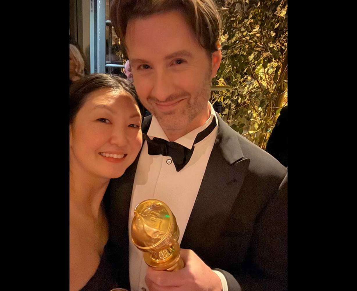 Chris Appelhans, right, with his wife, Maurene Goo, holding his Golden Globe award. The filmmaker from Idaho Falls makes up half the writing and directing team for Netflix's "most-watched original title."