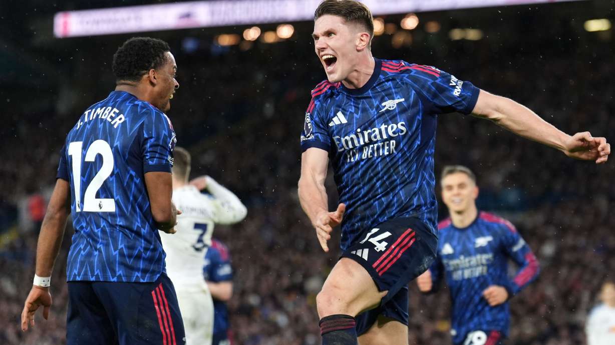 Arsenal's Viktor Gyokeres, right, celebrates scoring his side's third goal of the game with team-mate Jurrien Timber during the English Premier League soccer match between Leeds United and Arsenal in Leeds, England, Saturday, Jan. 31, 2026.