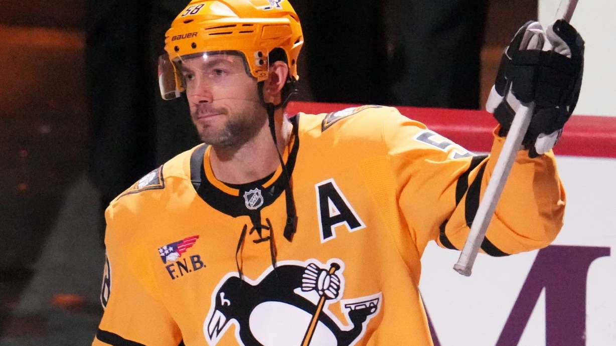 Pittsburgh Penguins' Kris Letang acknowledges being named the games number one start after scoring the gamin-winning goal in the overtime period of an NHL hockey game against the Detroit Red Wings in Pittsburgh, Thursday, Jan. 1, 2026.
