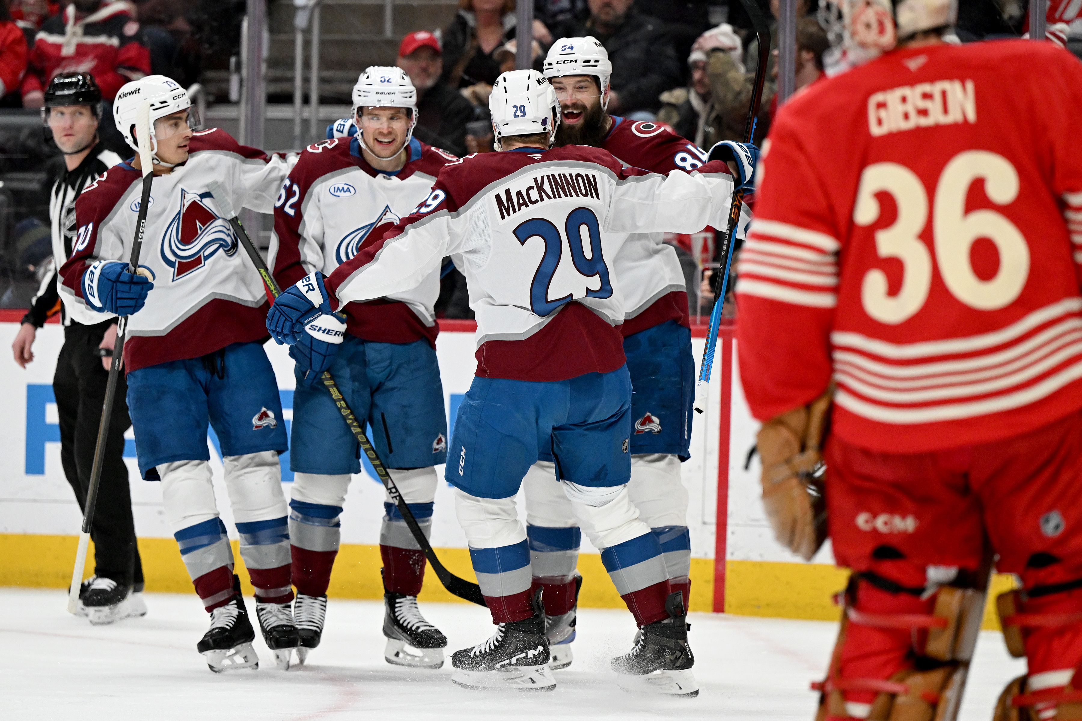 Colorado defenseman Brent Burns (84) celebrates with Colorado defenseman Sam Malinski (70), Colorado left wing Artturi Lehkonen (62) and Colorado center Nathan MacKinnon (29) after scoring a goal against Detroit in the first period of an NHL hockey game Saturday, Jan. 31, 2026 in Detroit. 