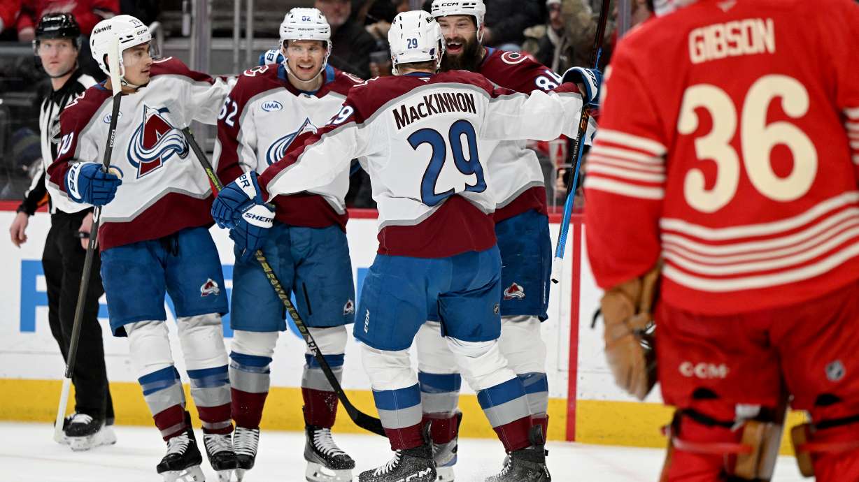 Colorado defenseman Brent Burns (84) celebrates with Colorado defenseman Sam Malinski (70), Colorado left wing Artturi Lehkonen (62) and Colorado center Nathan MacKinnon (29) after scoring a goal against Detroit in the first period of an NHL hockey game Saturday, Jan. 31, 2026 in Detroit.