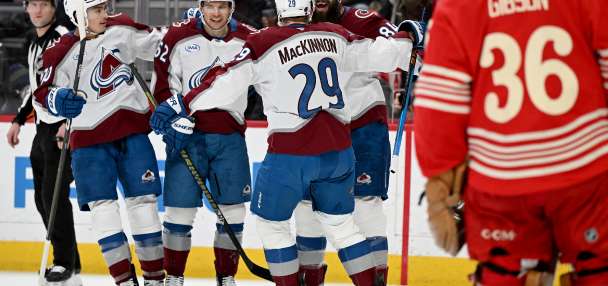 MacKinnon scores twice to become the 1st 40-goal scorer of the season, Avalanche blank Red Wings 5-0