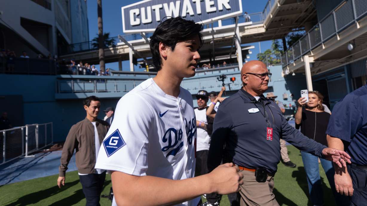Los Angeles Dodgers two-way player Shohei Ohtani arrives to talk to reporters during DodgerFest at Dodger Stadium in Los Angeles, Saturday, Jan. 31, 2026.