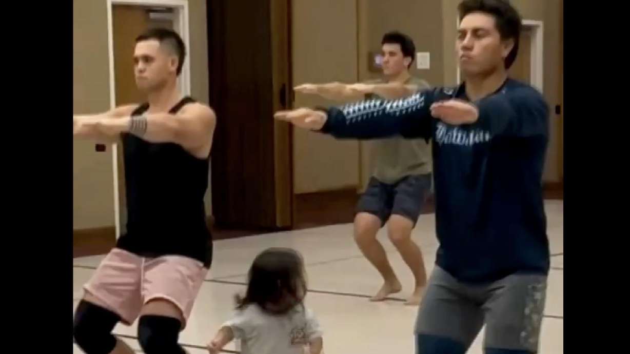 Eighteen-month-old Kuanao'o Burke joins in a dance rehearsal with members of his family's hula halau in Laie, Hawaii.
