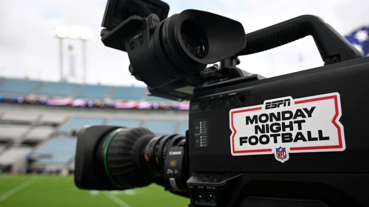 FILE - An ESPN Monday Night Football logo is viewed on a broadcast camera before an NFL football game between the Jacksonville Jaguars and the Kansas City Chiefs, Oct. 6, 2025, in Jacksonville, Fla.