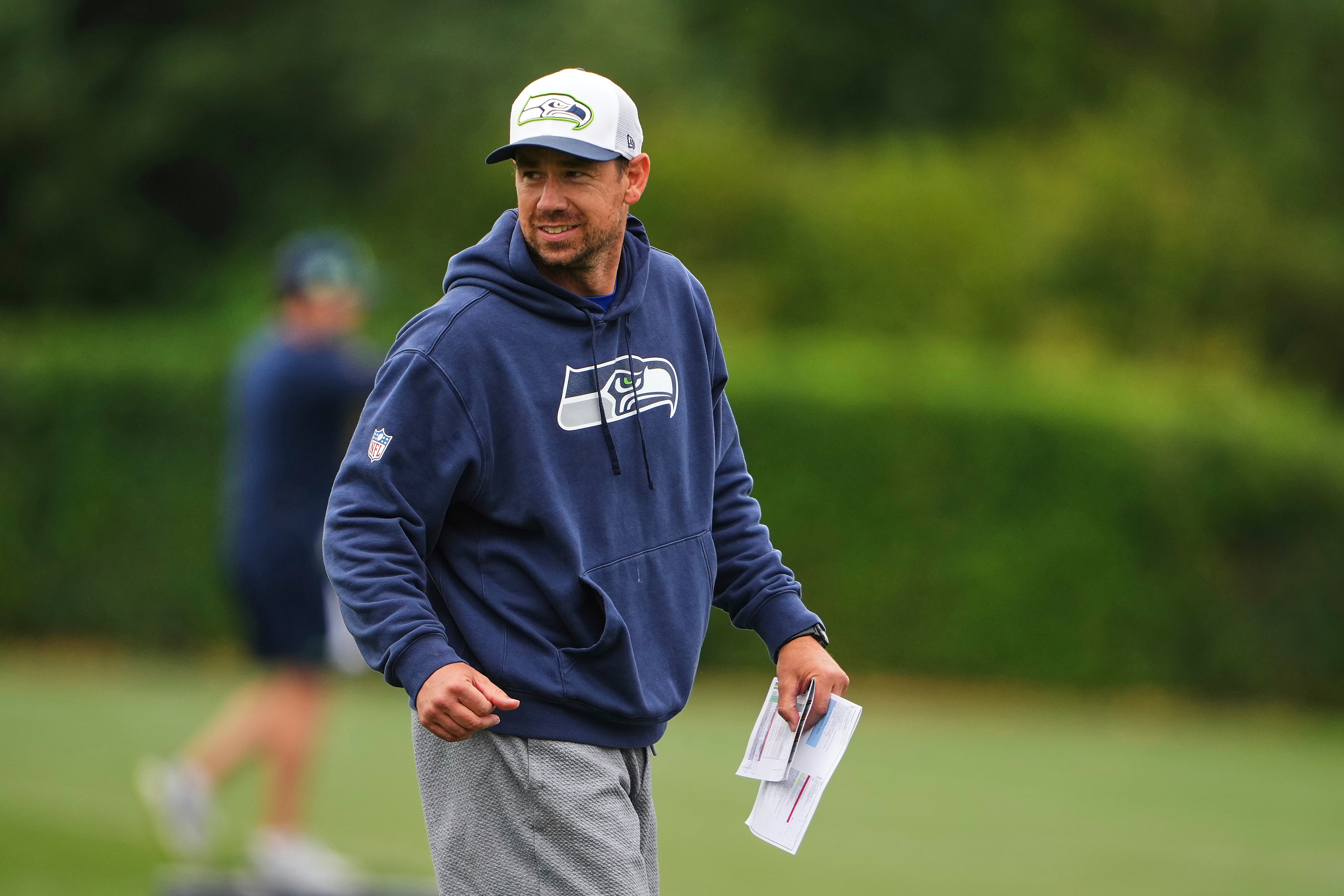 FILE - Seattle Seahawks offensive coordinator Klint Kubiak walks on the field during the NFL football team's training camp July 26, 2025, in Renton, Wash. 