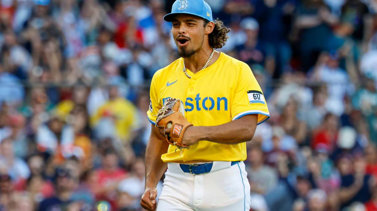 FILE - Boston Red Sox's Jordan Hicks reacts after striking out Houston Astros' Carlos Correa in the eighth inning of a baseball game, Aug. 2, 2025, in Boston.