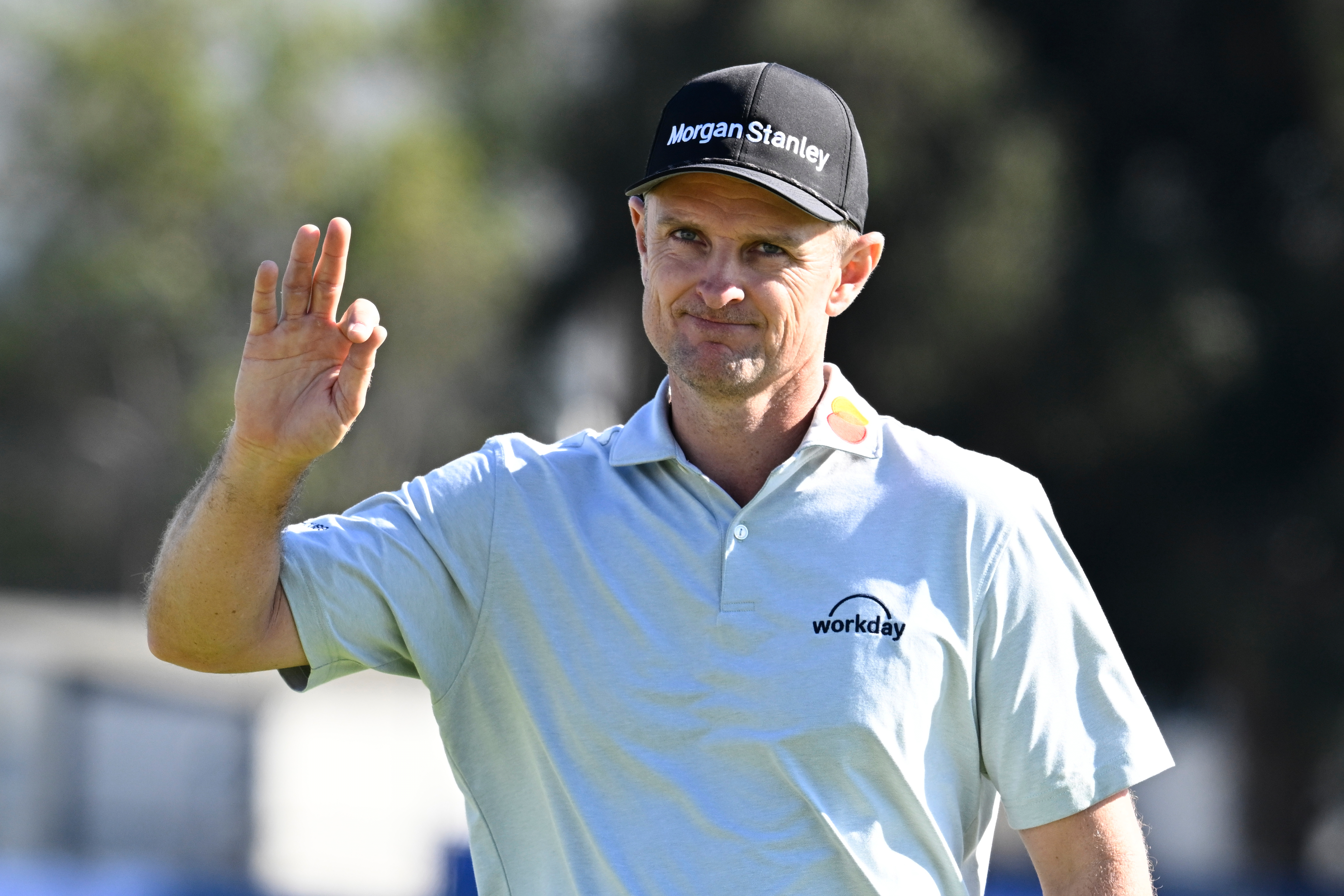 Justin Rose, of England, waves to the gallery on the 15th green of the South Course at Torrey Pines during the final round of the Farmers Insurance Open golf tournament Sunday, Feb. 1, 2026, in San Diego. 
