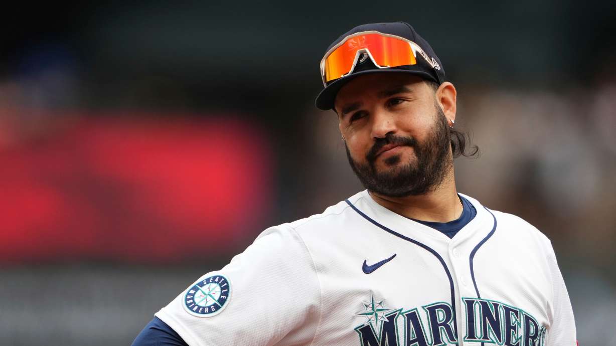 FILE - Seattle Mariners third baseman Eugenio Suarez looks on during a baseball game against the San Diego Padres, Aug. 27, 2025, in Seattle.