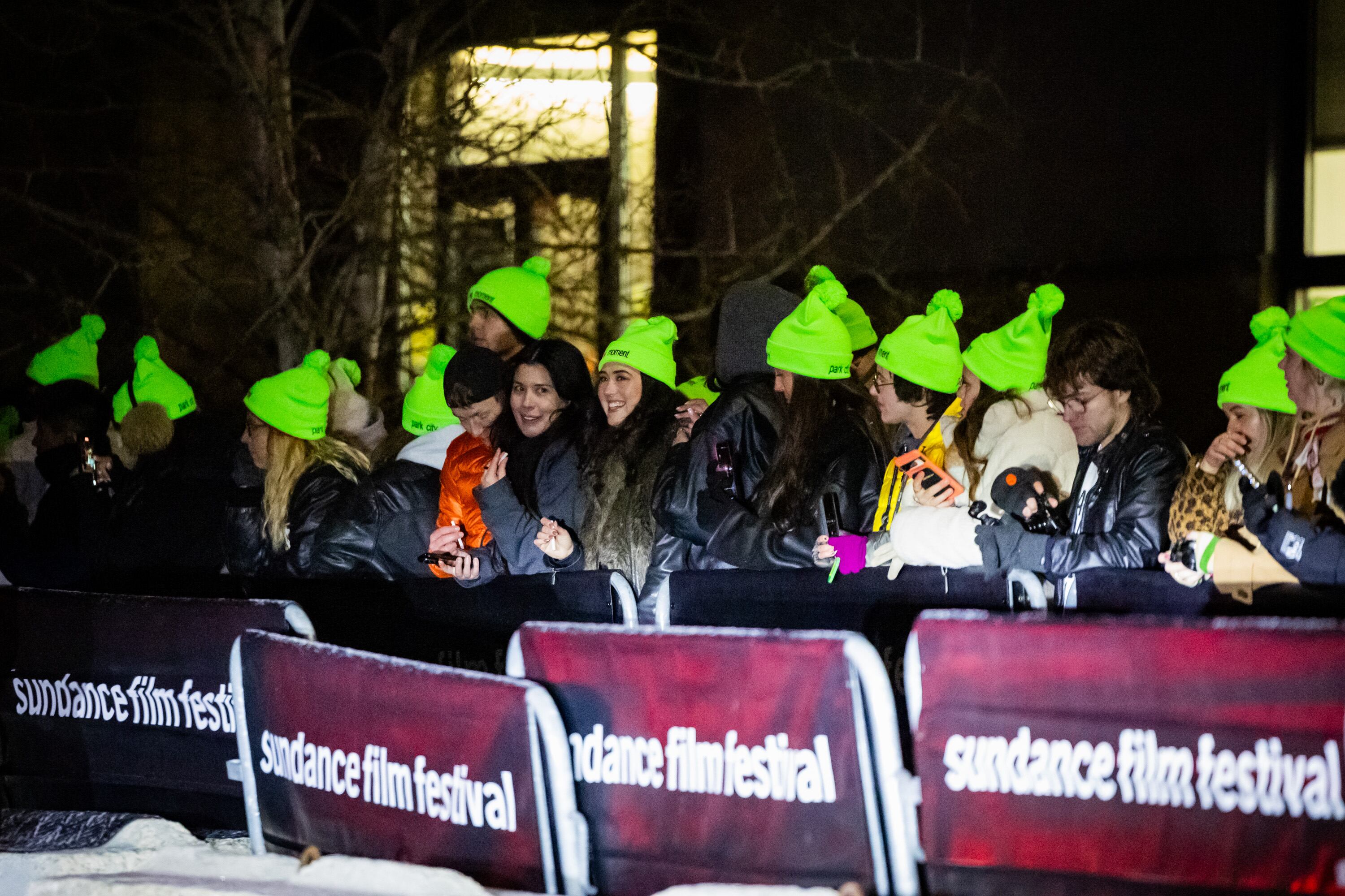 Fans wear “The Moment” hats as they wait for Charli XCX to arrive at the Eccles Theatre for the premiere of the film in Park City during the final Sundance Film Festival in Utah on Jan. 23.