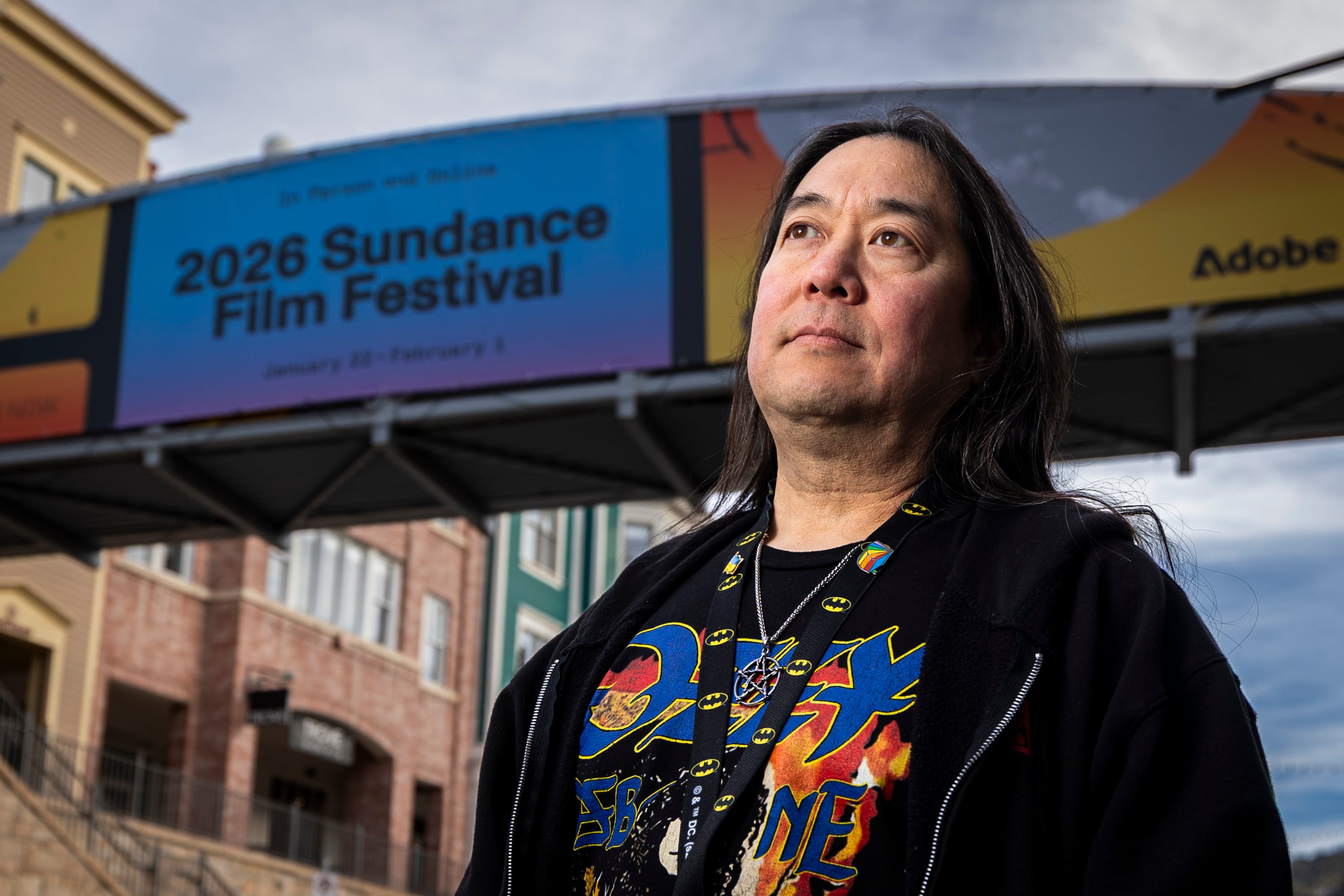 Scott Iwasaki, scene editor at The Park Record who has covered the Sundance Film Festival for 30 years, poses for a portrait along Main Street in Park City on Jan. 20.