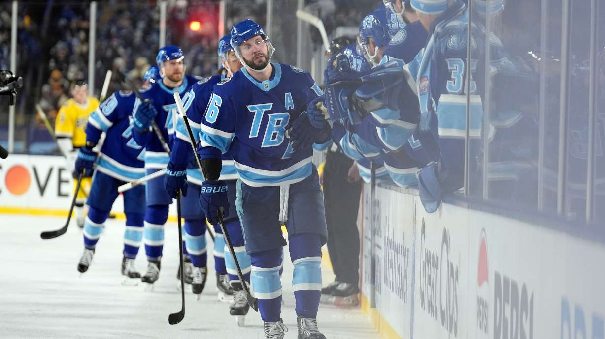 Tampa Bay Lightning right wing Nikita Kucherov (86) celebrates with the bench after his goal against the Boston Bruins during the thirdd period of a Stadium Series NHL hockey game Sunday, Feb. 1, 2026, in Tampa, Fla.
