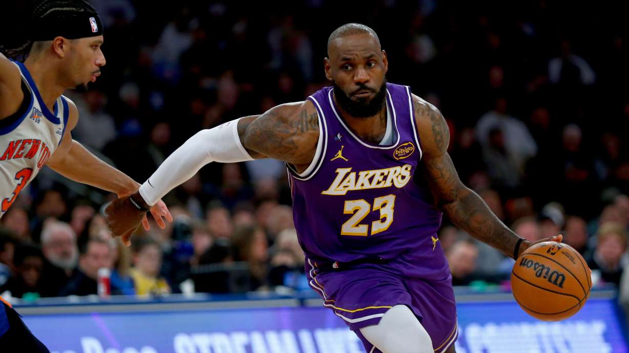 New York Knicks guard Josh Hart, left, defends against Los Angeles Lakers forward LeBron James, right, during the second half of an NBA basketball game, Sunday, Feb. 1, 2026, in New York.