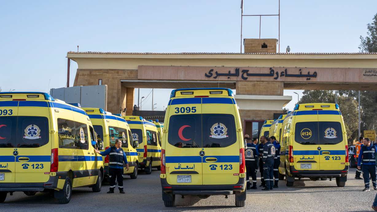 Ambulances line up to enter the Egyptian gate of the Rafah crossing on the way to the Gaza Strip, in Rafah, Egypt, Sunday.