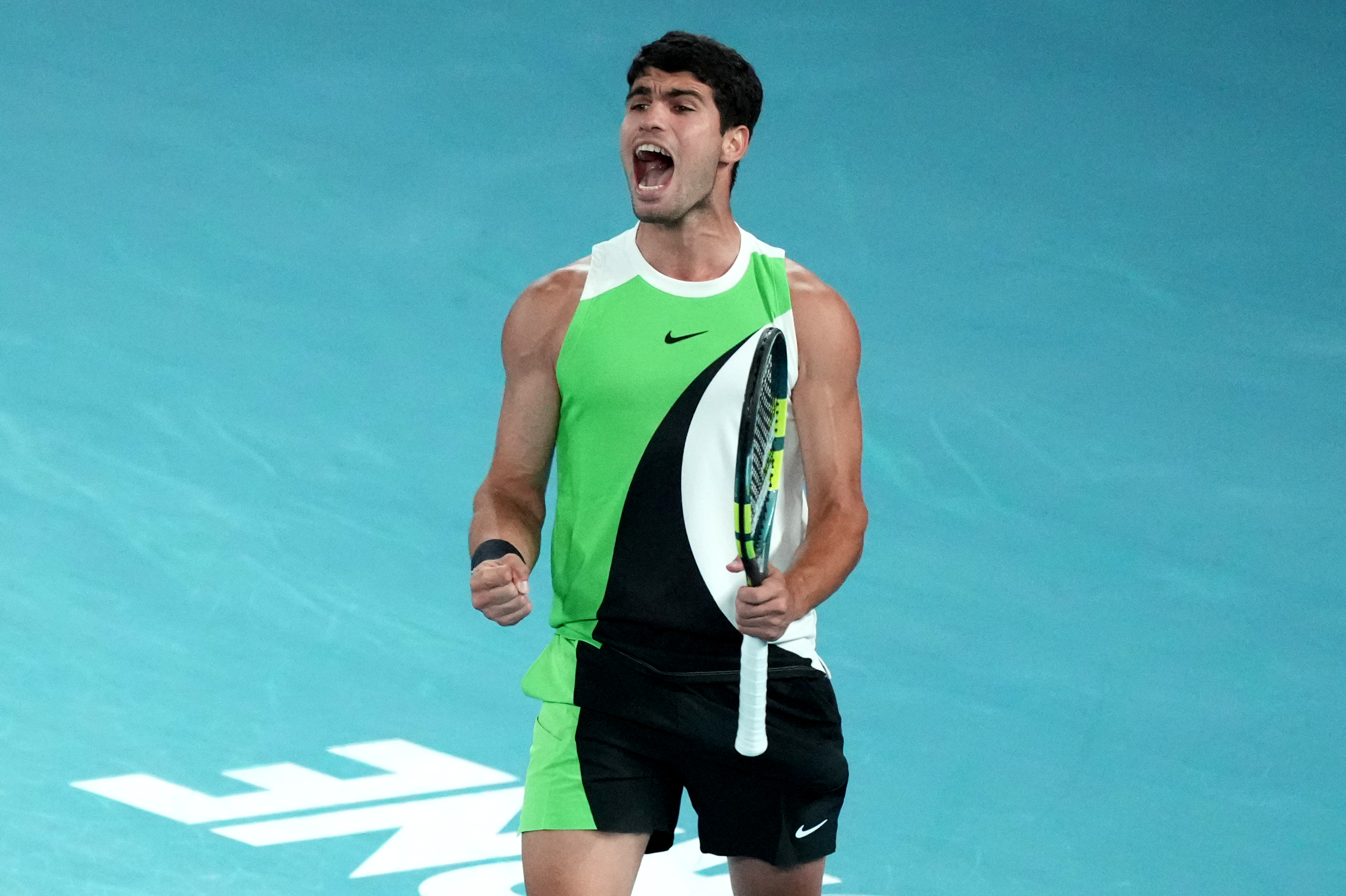 Carlos Alcaraz of Spain reacts during the men's singles final match against Novak Djokovic of Serbia at the Australian Open tennis championship in Melbourne, Australia, Sunday, Feb. 1, 2026.