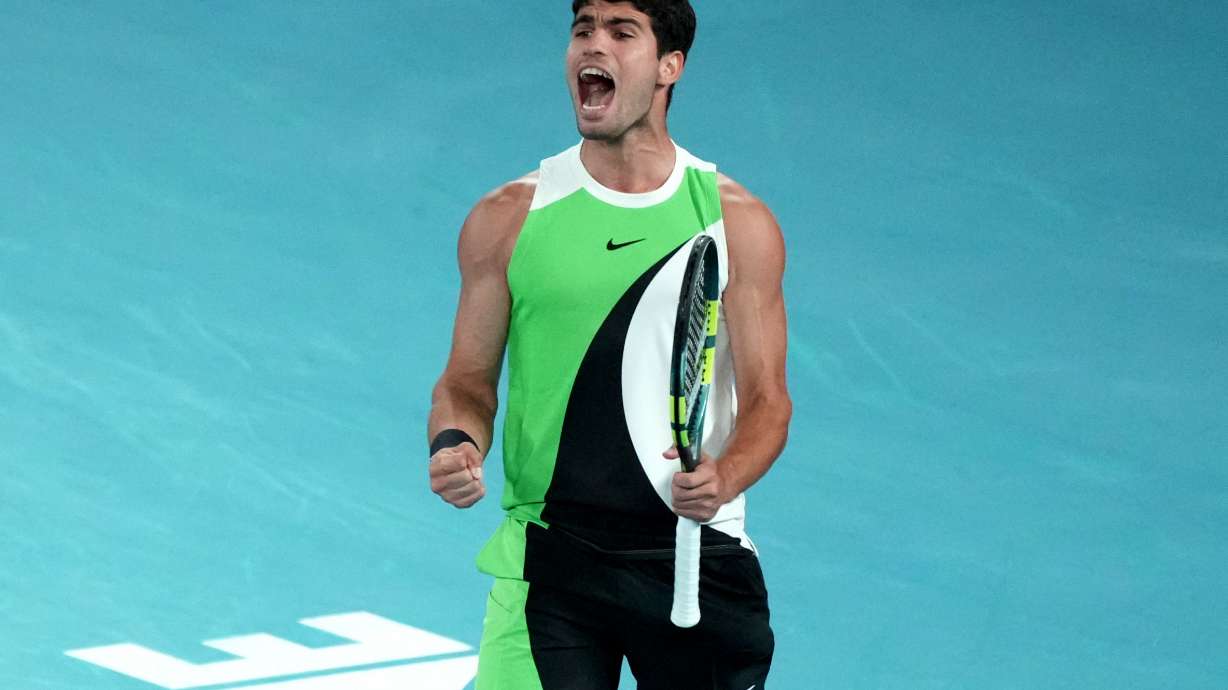 Carlos Alcaraz of Spain reacts during the men's singles final match against Novak Djokovic of Serbia at the Australian Open tennis championship in Melbourne, Australia, Sunday, Feb. 1, 2026.