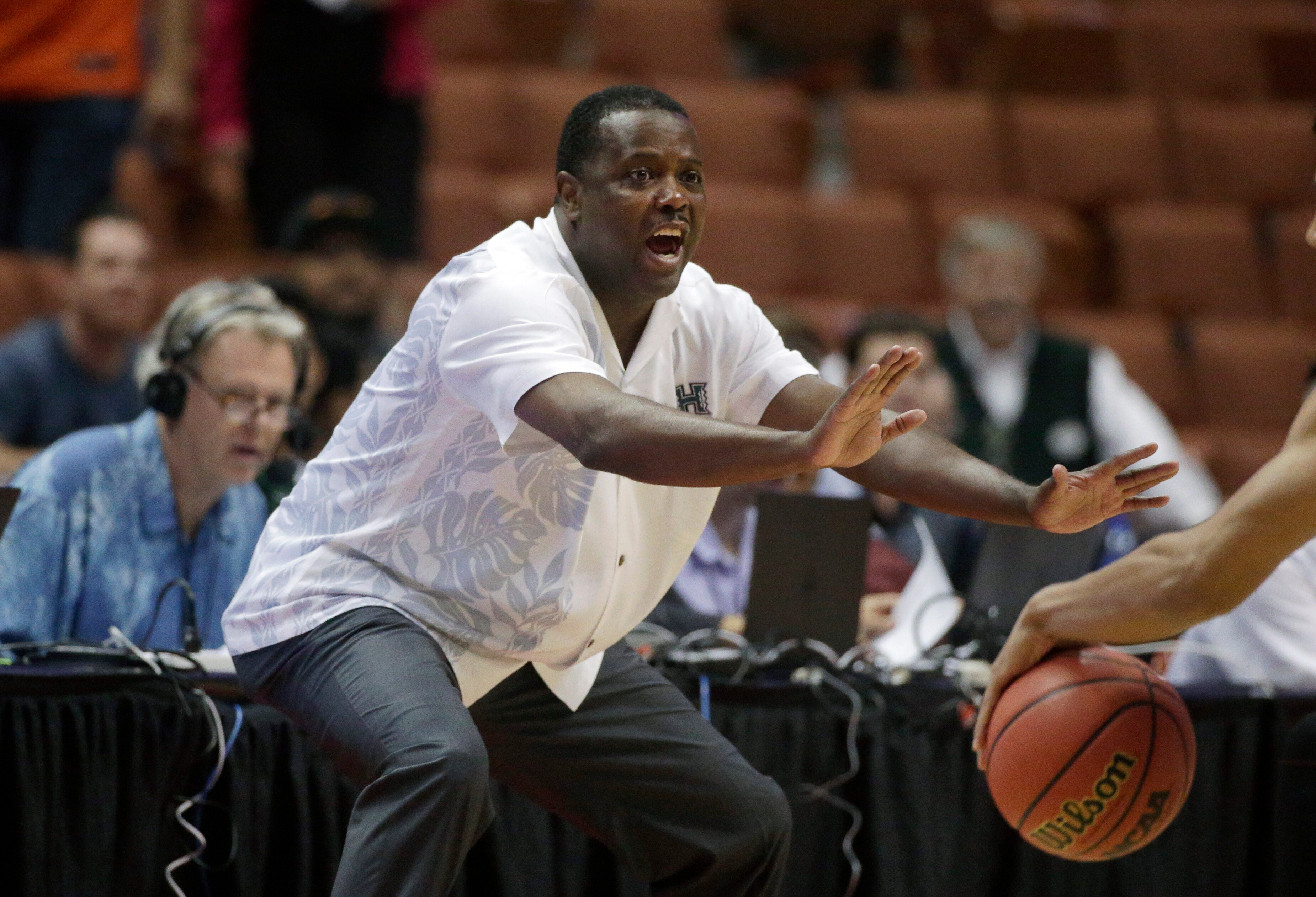 FILE - Hawaii coach Benjy Taylor gestures to his team during the first half of an NCAA college basketball game against UC Davis in the semifinals of the Big West Conference tournament, March 13, 2015, in Anaheim, Calif. 