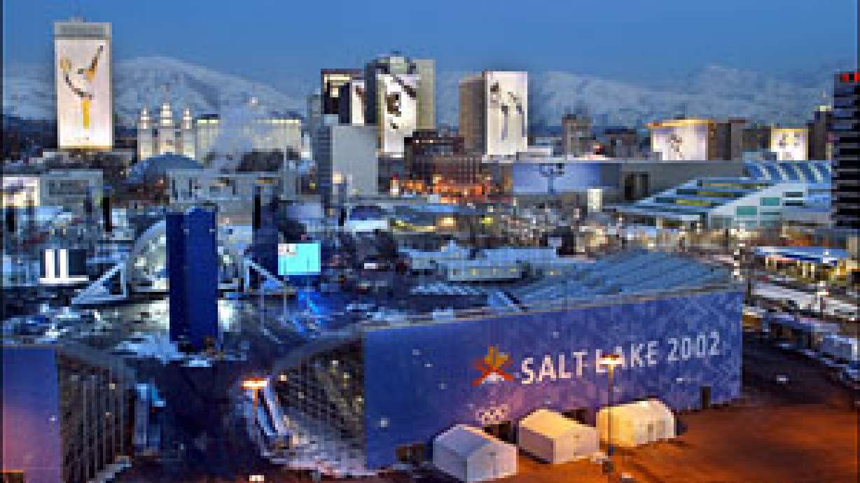 The Salt Lake skyline is lit with Olympic banners and the medals plaza on Jan. 29, 2002. The Church of Jesus Christ announced its support Tuesday of the 2034 Games, including money and the use of Block 85 as an Olympic venue.