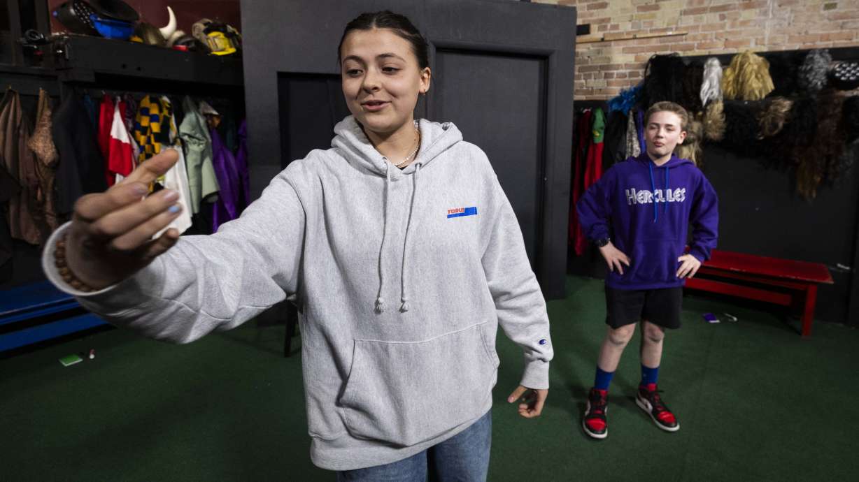Adelaida Dunn, 15, left, pantomimes picking up a jar of pickles while acting out an improvised skit with Korbin Butcher, 12, right, during an Improv Academy Class for homeschooled children at ComedySportz Utah in Provo on Jan. 28, 2025.