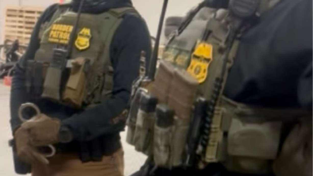 Two of the three U.S. Border and Customs Protection agents who detained two immigrants in an encounter on Thursday at a West Valley City auto body shop.